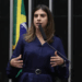 Camila Jara, acusada de empurrar Nikolas Ferreira, não está na lista inicial de deputados investigados pela Corregedoria da Câmara. Imagens podem mudar cenário.