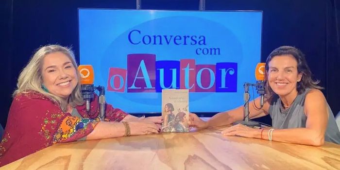 A escritora Luize Valente participa do programa Conversa com o Autor, da Rádio MEC, para falar sobre seu novo romance "A Confraria da Oliveira", que aborda memória, identidade e heranças familiares.