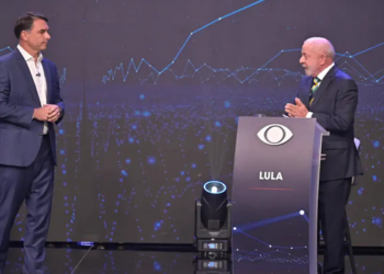 Lula e Flávio Bolsonaro protagonizam debate tenso na Band, com acusações, propostas para segurança pública, SUS, escala 6x1 e discussão sobre sigilos bancários.